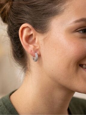 Sparkling  Hoop Earrings They are made of silver.
